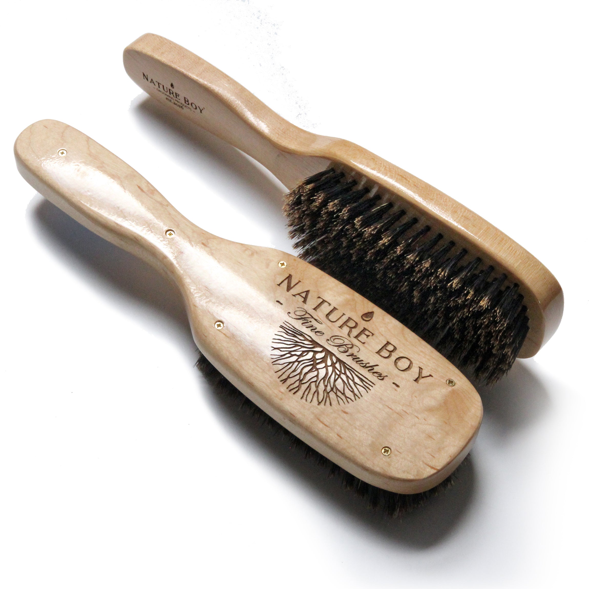 A WE R. & SONS natural wood nail brush with plant-based bristles.